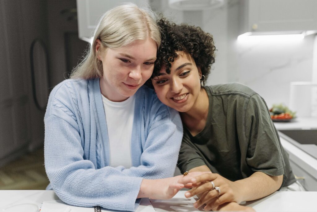 Two women holding hands and enjoying the moment